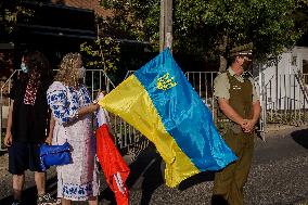 Ukrainian citizens in Chile protest outside the Russian Embassy